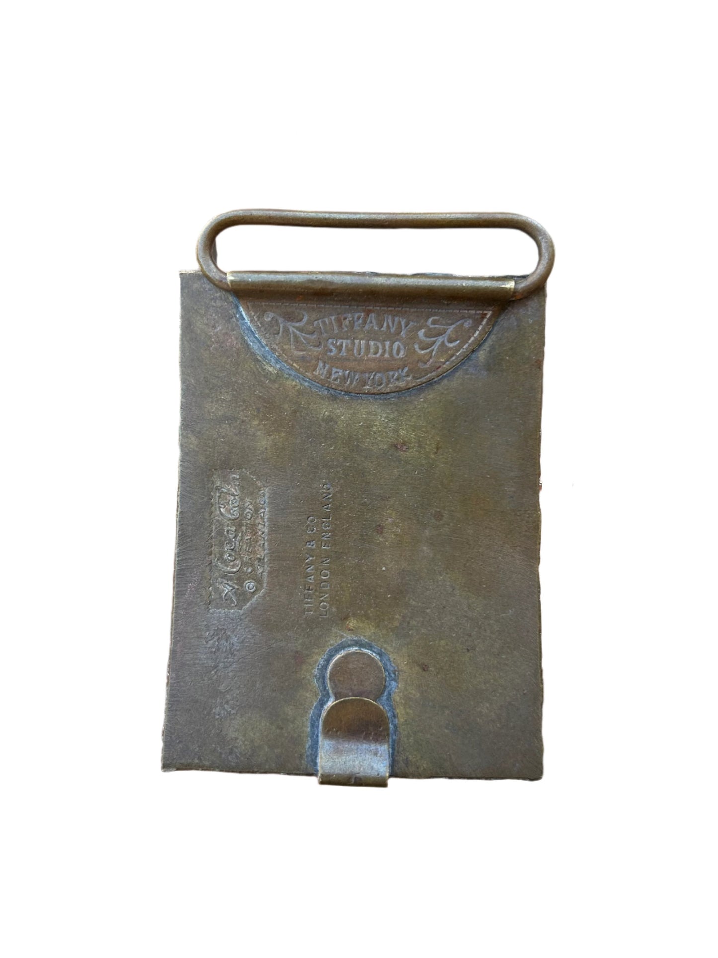 Back view of the 1970s Coca-Cola belt buckle by Tiffany & Co., featuring engraved 'Tiffany Studio New York' marking and fine craftsmanship, a testament to its authenticity and collectible value.