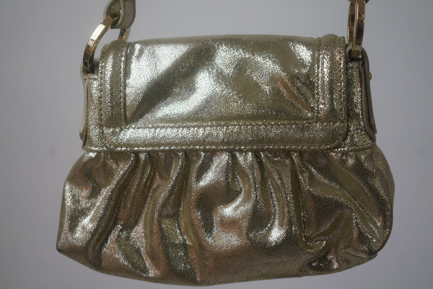 Close-up of the 2004 Fendi Metallic Napa Mini Chef Shoulder Bag in gold, highlighting its textured leather finish, ruched detailing, and luxury craftsmanship.