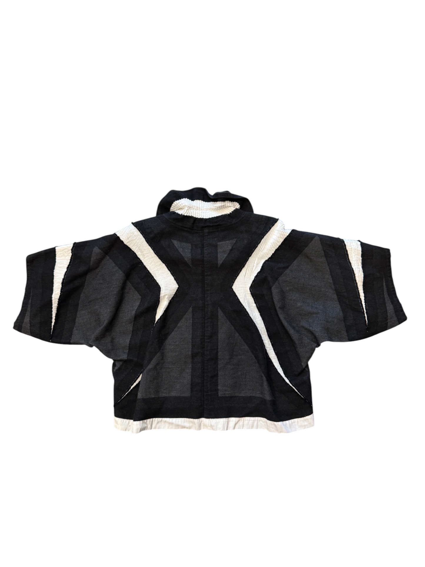 Black and white jacket with geometric design on a white background