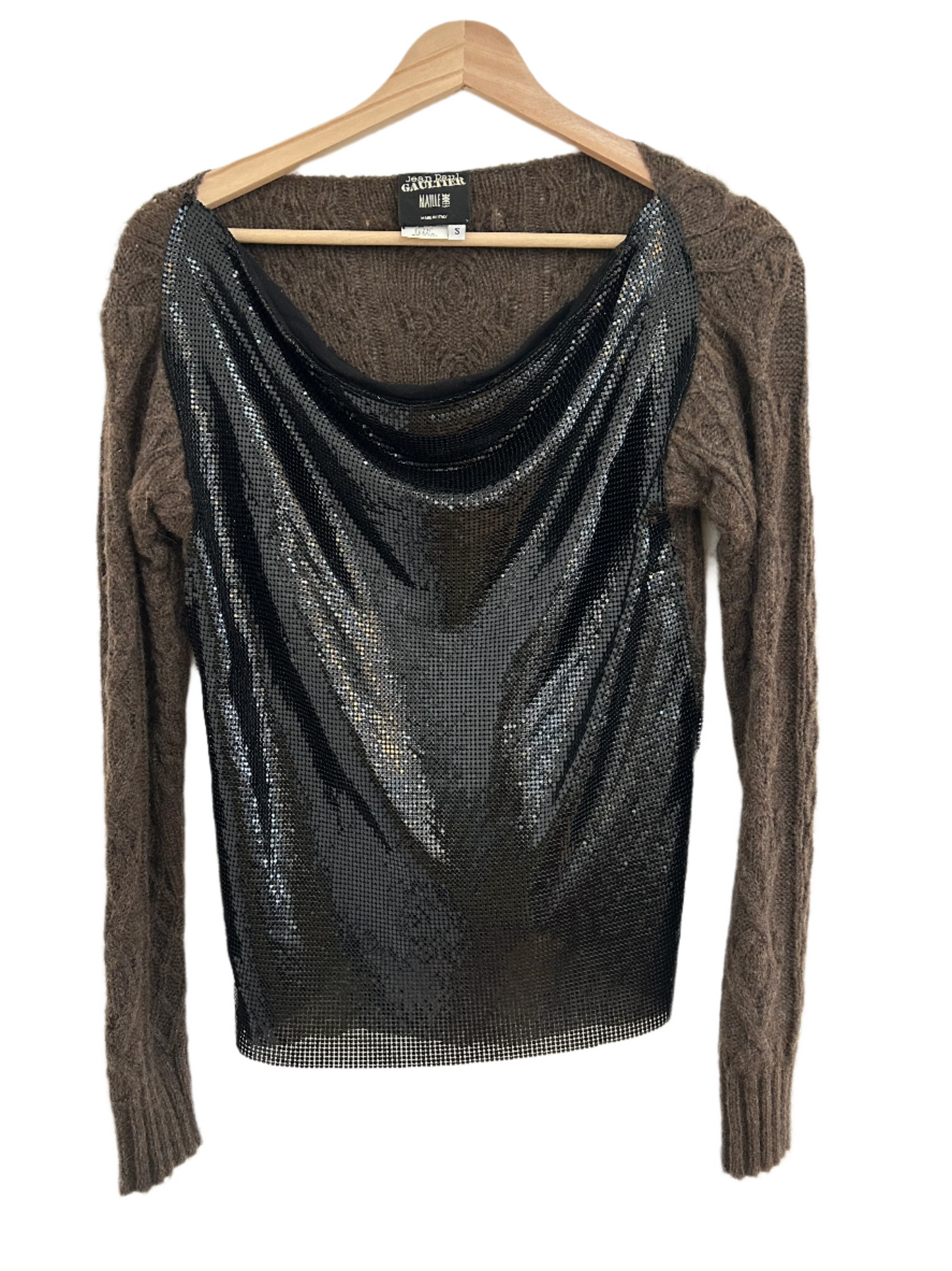 front-facing view of the 2000's Jean Paul Gaultier Chainmail Sweater captures the stunning juxtaposition of the shimmering chainmail front panel against the cozy, textured wool sleeves. A truly unique statement piece that embodies avant-garde luxury and iconic craftsmanship.