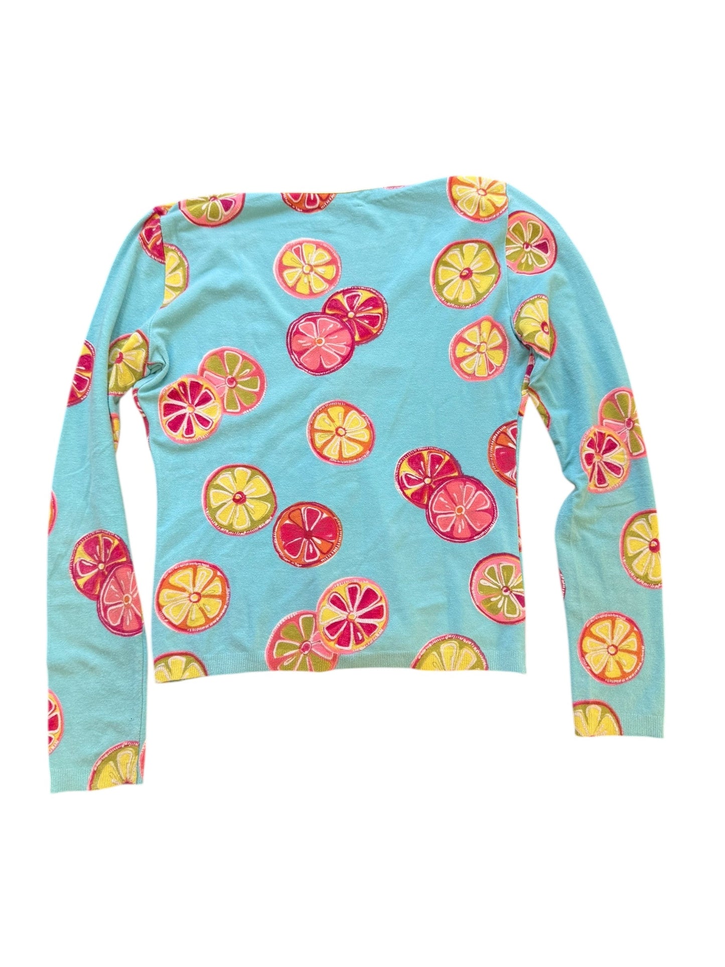 Long-sleeve shirt with colorful fruit pattern on a light blue background