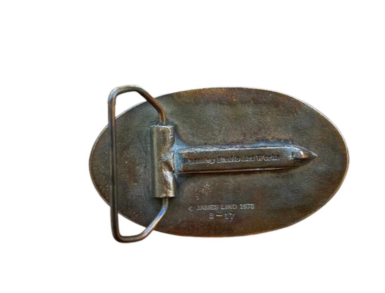 Back view of a vintage 1973 Dr Pepper belt buckle, showcasing the sturdy metal clasp and engraved maker's mark from James Lind. A collectible accessory highlighting retro craftsmanship and soda brand memorabilia.