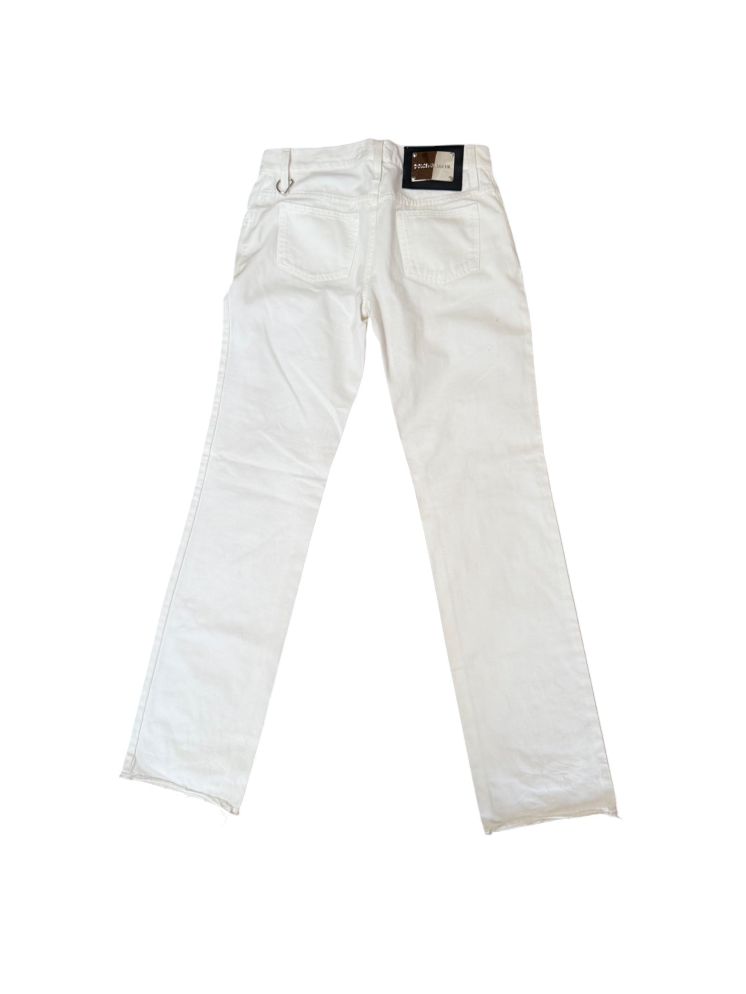 A pair of Dolce & Gabbana white flare denim pants with a tag visible on the waistband.