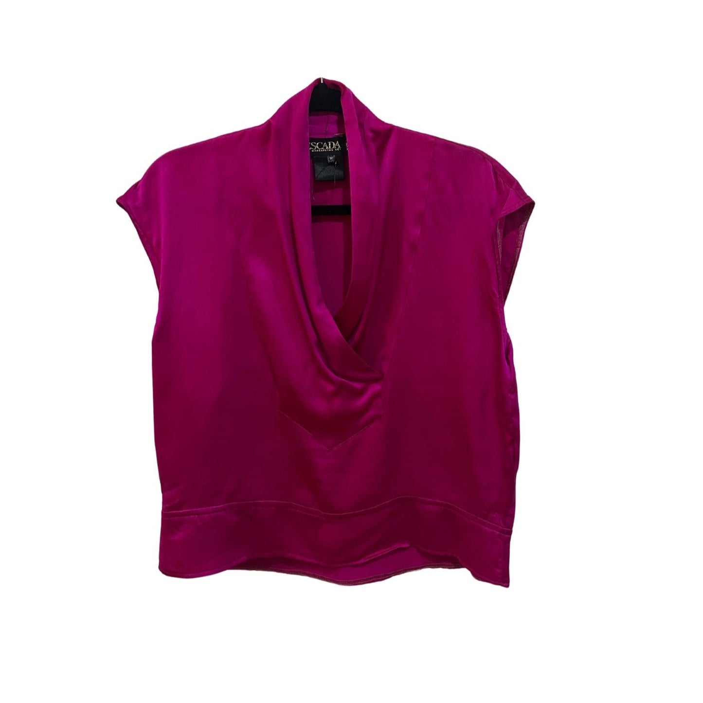 A luxurious fuchsia silk blouse by Escada displayed from the front. The top features a deep draped cowl neckline that creates a flowing effect, with short sleeves that have a subtle cap design. The smooth fabric showcases a rich sheen, and the blouse has a clean, simple hemline that ends just above the waist. The label is visible at the neck, adding a touch of brand recognition.