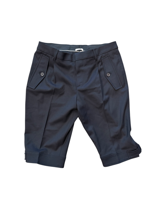 Folded navy blue pants on a white background