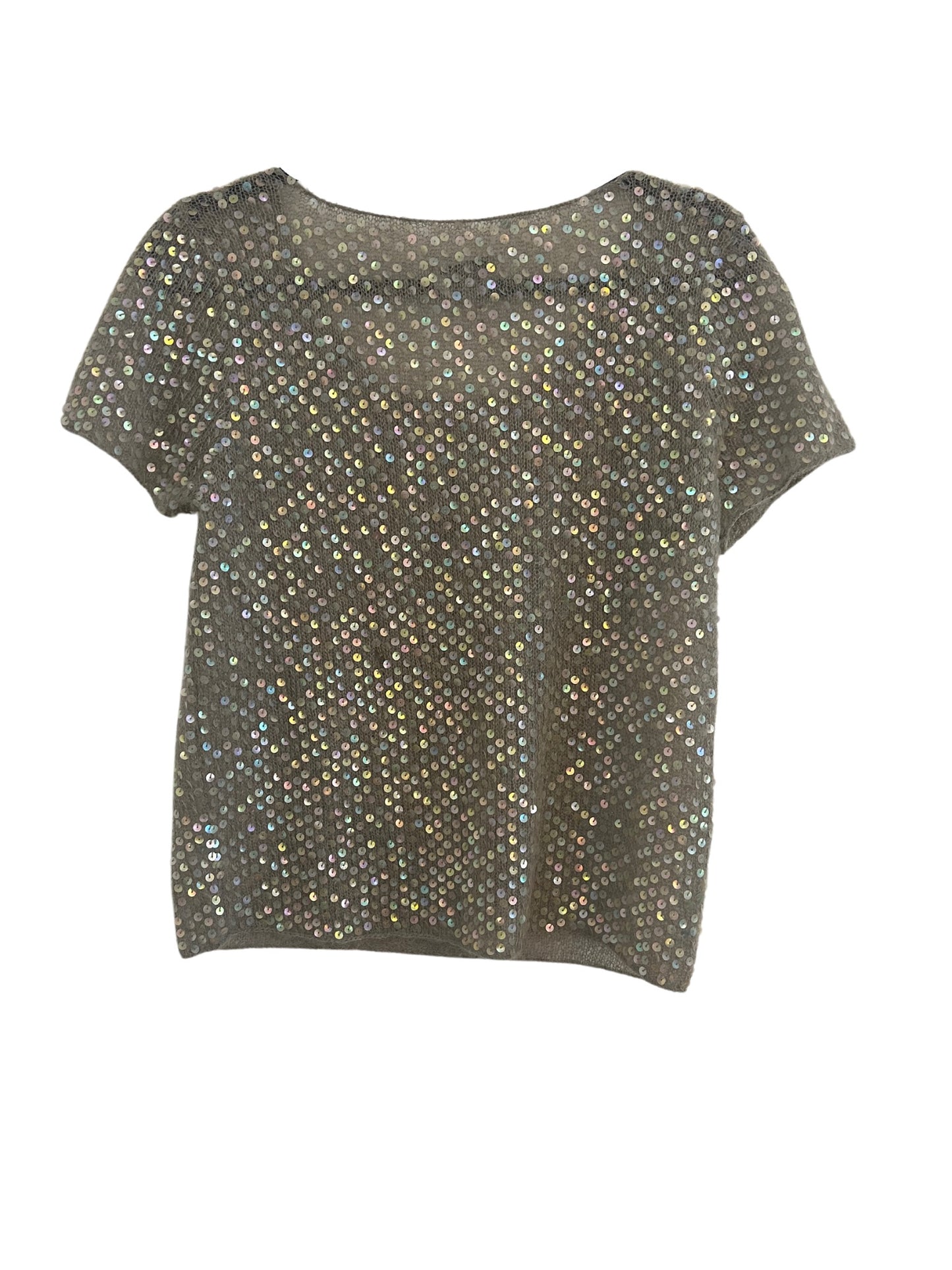 A Moschino sequin twin top displayed flat. The top is a gray knit garment fully covered with iridescent sequins that shimmer in different hues. It features a round neckline and short sleeves, with the sequins reflecting light across the entire surface, creating a dazzling effect.