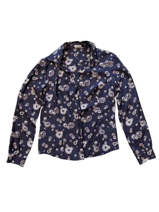 Navy blue blouse with white floral pattern on a white background